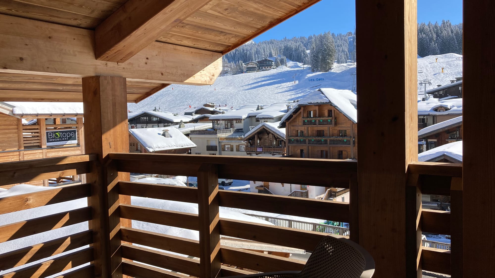 Balcony with view on snowy village